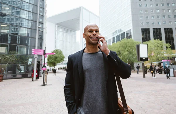 Stock image young business man going to work in the morning passing by the financial street area of the city .Representation of a successful sales person reaching the top of the career.