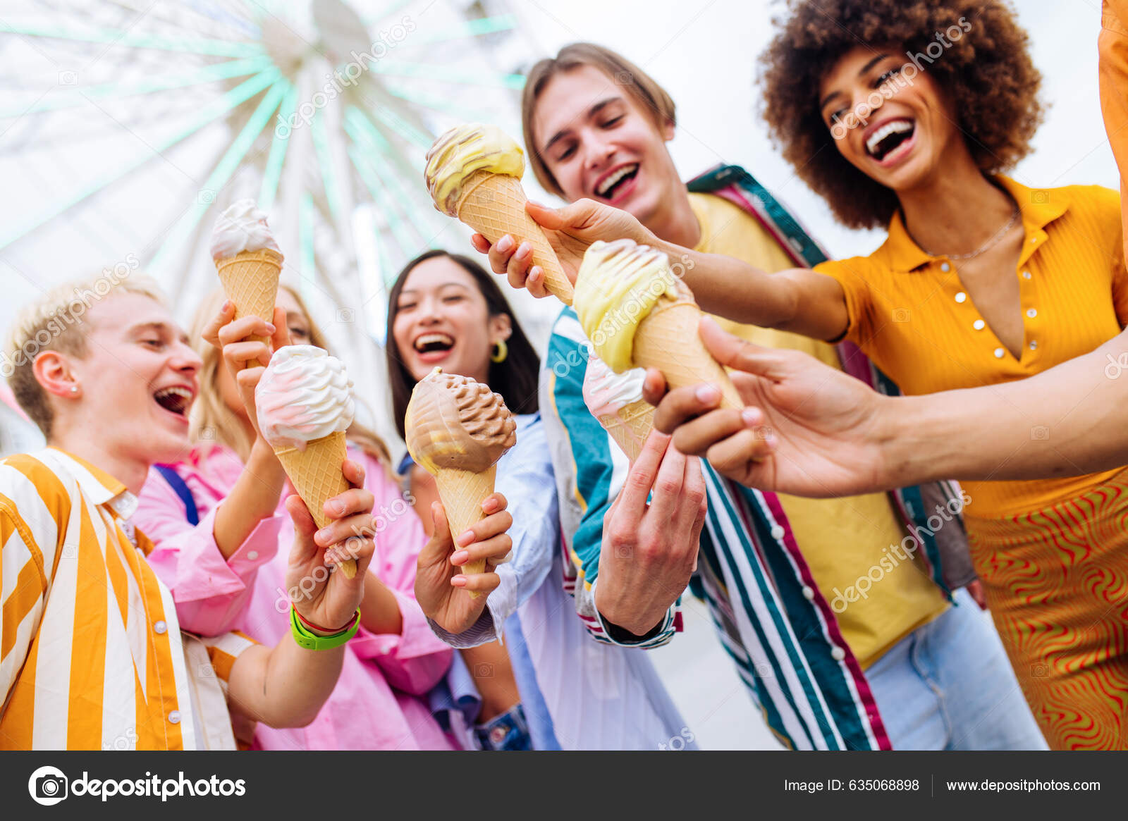 Premium Photo  Multiethnic friends in an ice cream parlor sitting eating  an ice cream summer showing off the ice creams