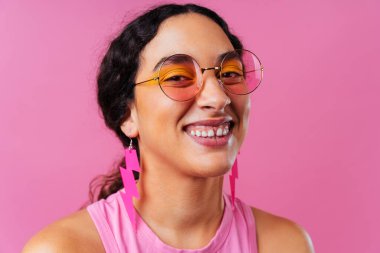 Beautiful young hispanic woman with diastema with colorful and cool style - Confident and interesting female with diverse and unique style, concepts about fashion, individuality and body acceptance
