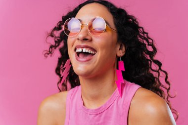 Beautiful young hispanic woman with diastema with colorful and cool style - Confident and interesting female with diverse and unique style, concepts about fashion, individuality and body acceptance