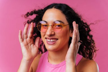 Beautiful young hispanic woman with diastema with colorful and cool style - Confident and interesting female with diverse and unique style, concepts about fashion, individuality and body acceptance