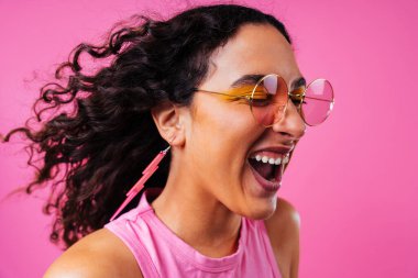 Beautiful young hispanic woman with diastema with colorful and cool style - Confident and interesting female with diverse and unique style, concepts about fashion, individuality and body acceptance