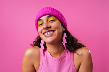 Beautiful young hispanic woman with diastema with colorful and cool style - Confident and interesting female with diverse and unique style, concepts about fashion, individuality and body acceptance