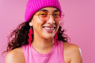 Beautiful young hispanic woman with diastema with colorful and cool style - Confident and interesting female with diverse and unique style, concepts about fashion, individuality and body acceptance