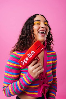 Beautiful young hispanic woman with diastema with colorful and cool style - Confident and interesting female with diverse and unique style, concepts about fashion, individuality and body acceptance