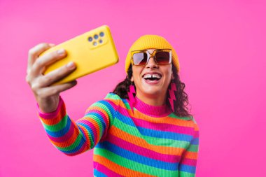 Beautiful young hispanic woman with diastema with colorful and cool style - Confident and interesting female with diverse and unique style, concepts about fashion, individuality and body acceptance