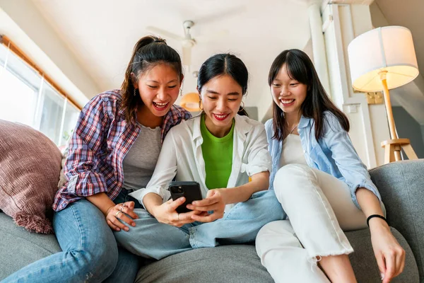 stock image Happy beautiful chinese women friends bonding at home - Playful pretty asian female adults meeting and having fun at home, concepts about lifestyle, domestic life and friendship