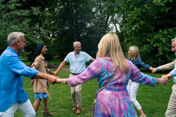 Group of old friends spending time together in the main parts of london, visiting the westminster area and st. james park. Old buddies reunion. Concept about third age and seniority