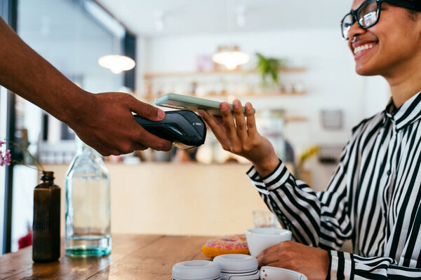 Bakery, happy portrait of hispanic black man in cafe ready for serving pastry, coffee and baked foods. Restaurant, coffee shop and confident waiter barista by counter for service, help and welcome