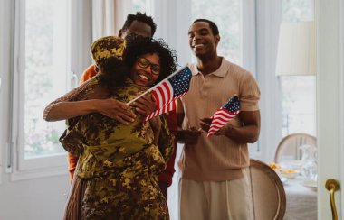 Us Veteran woman homecoming. Young woman coming back to her family from military service for holidays. Female soldier going back home to spend time with relatives. clipart