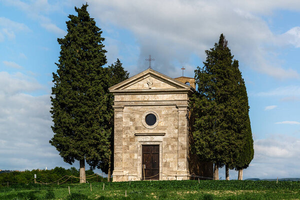 View on the Vitaleta Chapel and the surrounding hills of the Orcia Valley near San Quirico d'Orcia