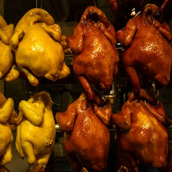 Roasted chicken and ducks hanging in a restaurant in Hong Kong