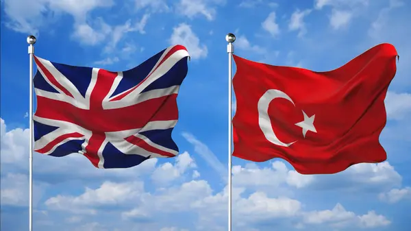 İngiltere ve Türkiye 'nin bayrakları gökyüzü arkaplanına karşı 3D render sallıyor