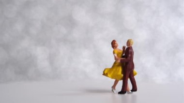 Miniature people Couple dancing on dance floor , International dance day concept