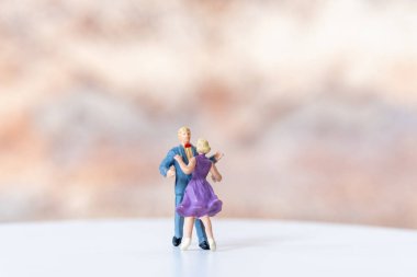 Miniature people Couple dancing on dance floor , International dance day concept