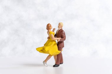 Miniature people Couple dancing on dance floor , International dance day concept