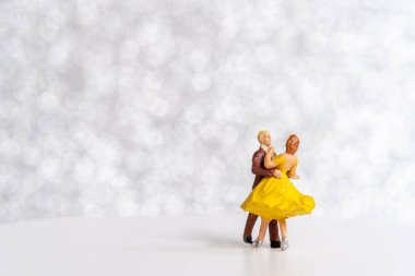 Miniature people Couple dancing on dance floor , International dance day concept