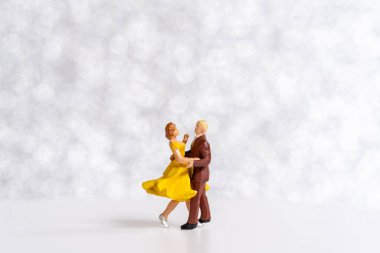 Miniature people Couple dancing on dance floor , International dance day concept