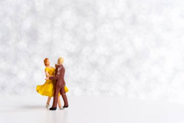 Miniature people Couple dancing on dance floor , International dance day concept