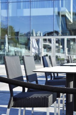 Restaurant with modern architecture and mediterranean atmosphere. Building constructed of glass walls wich reflect in sunshine.