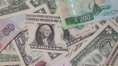 Stacked Russian ruble and US dollar banknotes for economic relations and exchange rates