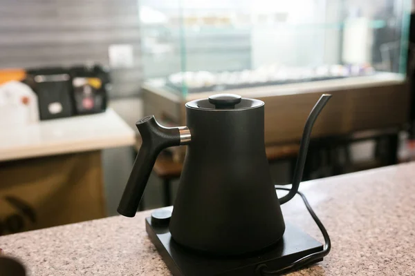 kettle in modern coffee shop interior.