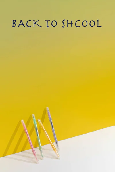 Phrase Back School Gel Pens Leaned Yellow Background Studio Painting — Stock Photo, Image