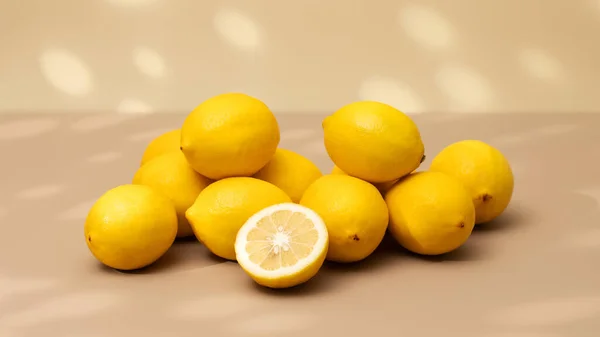 Handful Yellow Ripe Lemons Beige Background Shadow Pattern Juicy Lemons — Stock Photo, Image