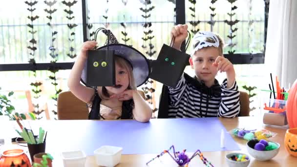 Cute Brother Sister Halloween Costumes Doing Festive Crafts Table Master — Stock Video