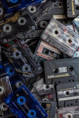 Barcelona, Spain - February 03, 2022: Cassette tapes of different brands and colors stacked