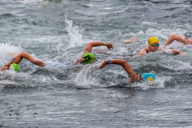 Barcelona, Spain - September 24, 2022: Swimmers during the Open Water Crossing in the Port of Barcelona, an event that takes place during the Merc de Barcelona festivities.