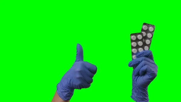 Frauenhände Latexblauen Handschuhen Zeigen Blasen Von Pillen Und Daumen Nach — Stockfoto