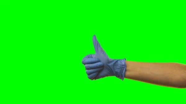 Mão Mulher Uma Luva Azul Médica Mostrando Gesto Polegar Para — Fotografia de Stock
