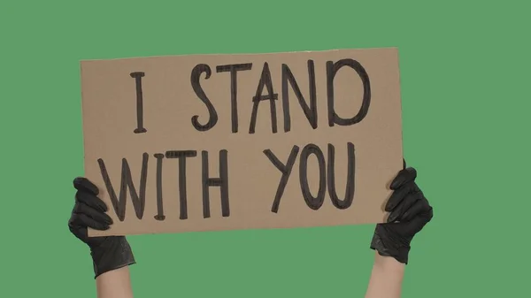 Ręce Nieznanej Osoby Czarnych Rękawiczkach Podnoszą Kartonowy Plakat Stand You — Zdjęcie stockowe