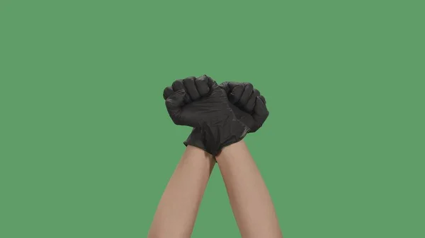 Crossed Hands Black Gloves Clenched Fists Raised Protest Green Screen — Stock Photo, Image