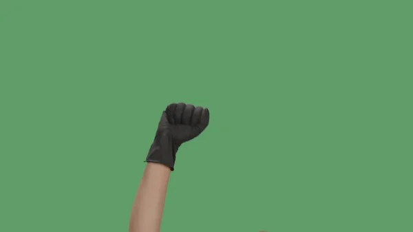 Erhobene Hand Schwarzem Handschuh Mit Geballter Faust Zum Protest Auf — Stockfoto