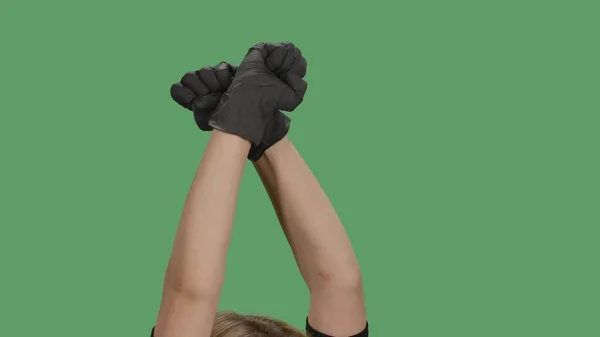 Crossed Hands Black Gloves Clenched Fists Raised Protest Green Screen — Stock Photo, Image