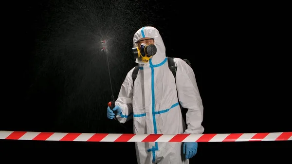 View Red Signal Tape Medical Worker White Protective Suit Spraying — Stock Photo, Image