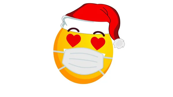 サンタクラスのクリスマスの帽子と白い背景の医療用マスクで 黄色の絵文字を賞賛し 肯定的な感情の概念 Covid19流行中の冬の休日の感情 ソーシャルメディア反応 — ストック写真