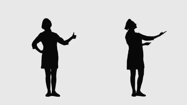 头戴厨师帽的黑人女性轮廓 大拇指翘起 指向侧边 两分一的大学堂前侧视图全长在白色背景上 厨师职业的概念 — 图库照片