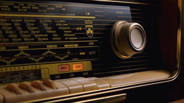 Front panel of vintage radio with frequency setting scale. Dashboard of an analog old radio close up