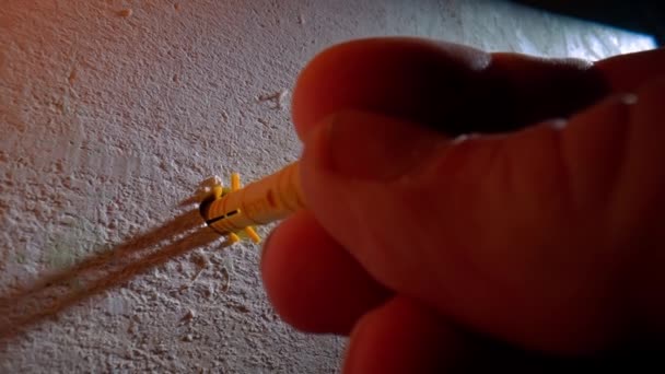 Macro Shot Builders Fingers Inserting Yellow Plastic Dowel Drilled Hole — Vídeo de Stock