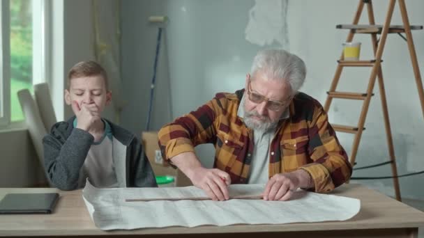 Grandpa Planning Repairs Making Notes Project Pencil Ruler Grandson Helping — Vídeo de Stock