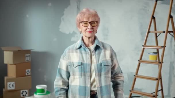 Elderly Woman Glasses Looking Camera Smiling Portrait Female Pensioner Blue — Wideo stockowe
