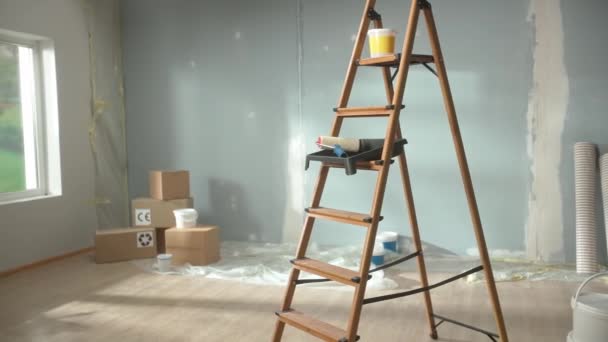Interior Empty Apartment Renovation Stepladder Stacks Cardboard Boxes Floor Rolls — Stockvideo