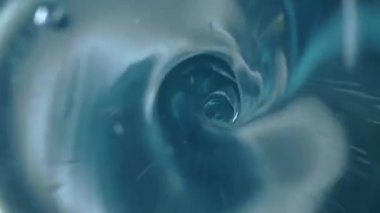 Spiral swirl of transparent blue water in a circular motion. A whirlpool of pure liquid forming a funnel with a round hole. The swirl of the sea surface, draining water in the bathroom, the leak in