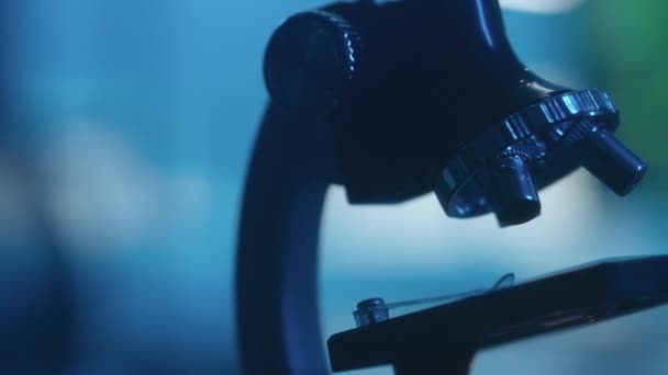 Camera Moves Microscope Dark Laboratory Soft Blue Light Laboratory Equipment — Stockvideo