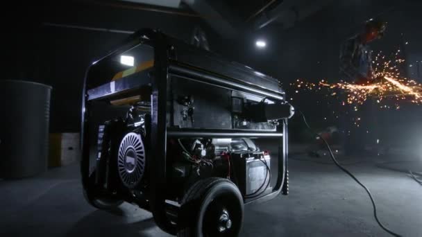 Black Mobile Gasoline Power Generator Dark Workshop Background Man Blue — Stockvideo