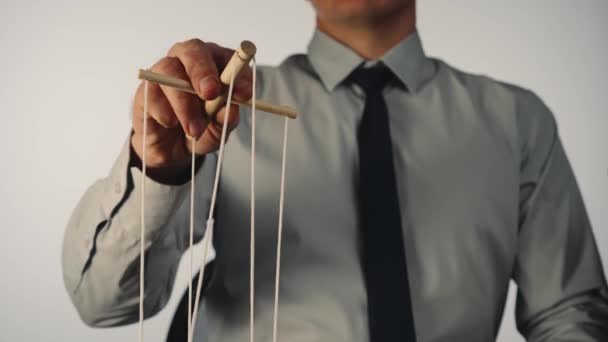 Businessman Gray Shirt Black Tie Controls Puppet Wooden Manipulator Strings — Videoclip de stoc