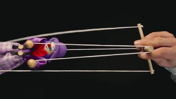 Hand Man Controls Clown Marionette Hanging Strings Rag Doll Purple — Video Stock